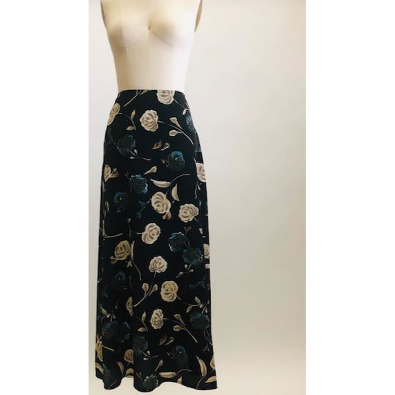 Vintage classic 90s black floral maxi skirt with a soft A-line silhouette, accented with teal and cream floral print. Unlined with center back zipper closure. 