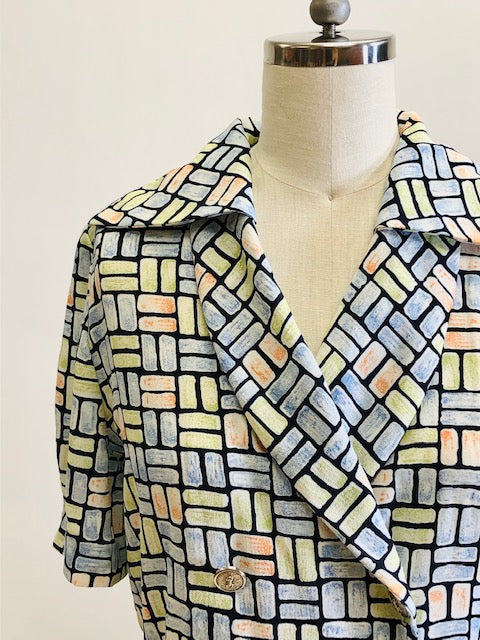 Vintage 80s style double breasted top with elasticated peplum waist, combination roll & pointed collar in a green, blue, orange rectangle pattern, accented with cute vintage silver buttons. Relaxed blousy fit looks chic with your favorite pair of vintage jeans. 