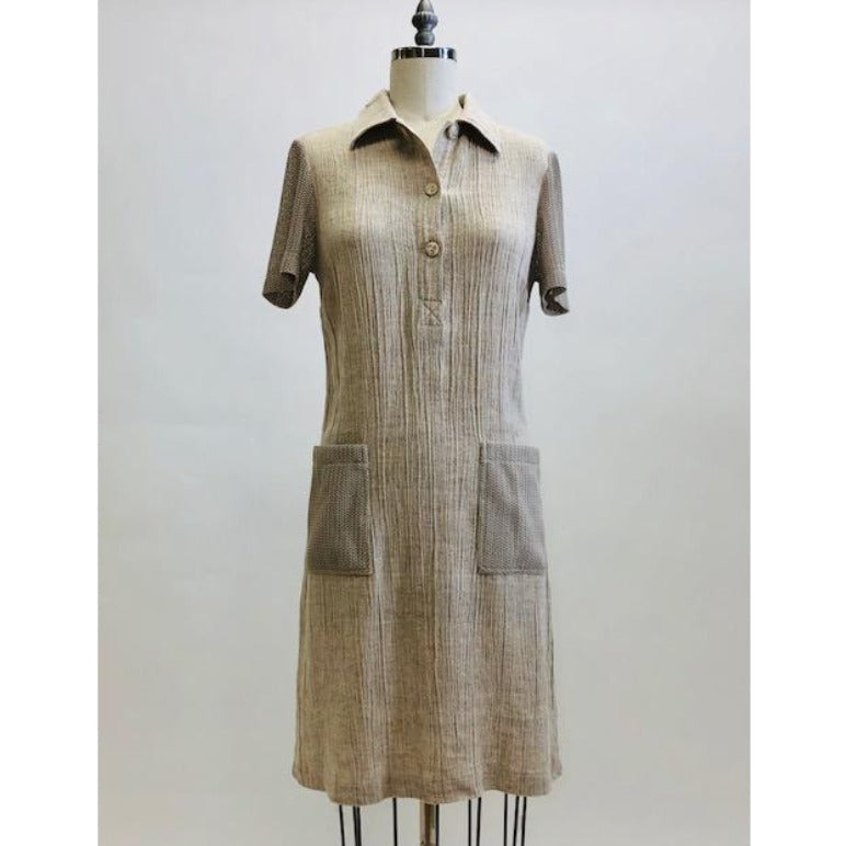 Adorable oatmeal tennis dress in a comfy flax/viscose blend accented with mesh patch pockets and sleeves. Ties at back to give waist contouring if desired, but actually fits nicely without even cinching the ties. Lovely dress in a unique fabrication, meant to as a relaxed fit.