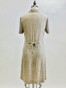 Adorable oatmeal tennis dress in a comfy flax/viscose blend accented with mesh patch pockets and sleeves. Ties at back to give waist contouring if desired, but actually fits nicely without even cinching the ties. Lovely dress in a unique fabrication, meant to as a relaxed fit.