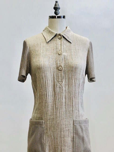 Adorable oatmeal tennis dress in a comfy flax/viscose blend accented with mesh patch pockets and sleeves. Ties at back to give waist contouring if desired, but actually fits nicely without even cinching the ties. Lovely dress in a unique fabrication, meant to as a relaxed fit.