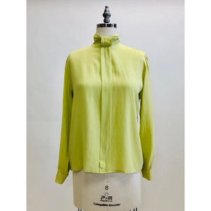 Exquisite lime silk blouse with lightly gathered neck band collar detail, button-down back, and long sleeves with buttoned cuffs. Looks beautiful paired with casual bottoms or as a dressy look.