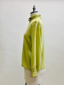 Exquisite lime silk blouse with lightly gathered neck band collar detail, button-down back, and long sleeves with buttoned cuffs. Looks beautiful paired with casual bottoms or as a dressy look.