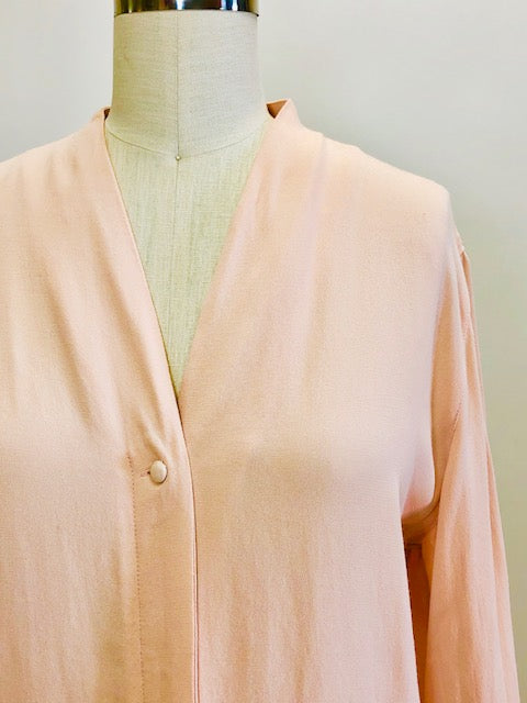 Romantic soft blush pink long-sleeve rayon blouse with v-neck line and hidden button-down front placket. Pairs beautifully with vintage denim or linen pants or skirt, or with dress pants for the office. 