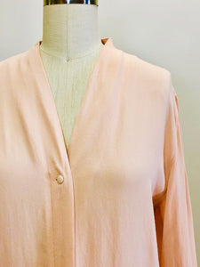 Romantic soft blush pink long-sleeve rayon blouse with v-neck line and hidden button-down front placket. Pairs beautifully with vintage denim or linen pants or skirt, or with dress pants for the office. 