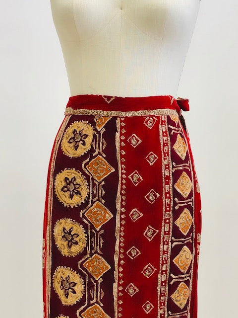 Gorgeous viscose wrap skirt in very unique red tribal print. Shapes beautifully with wrap style and waist ties. 