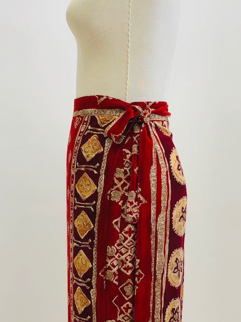 Gorgeous viscose wrap skirt in very unique red tribal print. Shapes beautifully with wrap style and waist ties. 