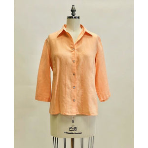 Beautiful peach linen 3/4 length sleeve button-down top with shell buttons. Relaxed fit with detailed stitching along front darts and back yoke. Versatile for in-between seasons, and pairs nicely with vintage Levi's or cropped chinos. 