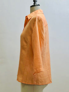 Beautiful peach linen 3/4 length sleeve button-down top with shell buttons. Relaxed fit with detailed stitching along front darts and back yoke. Versatile for in-between seasons, and pairs nicely with vintage Levi's or cropped chinos. 