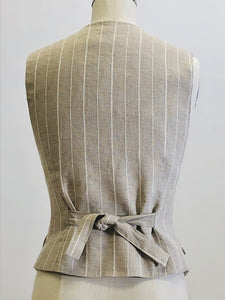 Oatmeal and white pinstripe lined vest with front flap pockets. Back waist ties for a fitted waist look. 