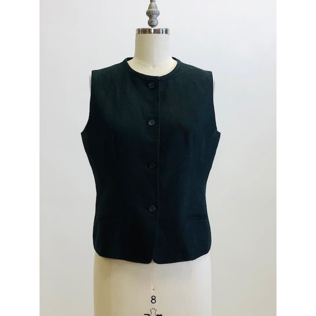 Classic black Irish linen box-style vest top with front welt pockets.  Collarless high rounded neckline. 