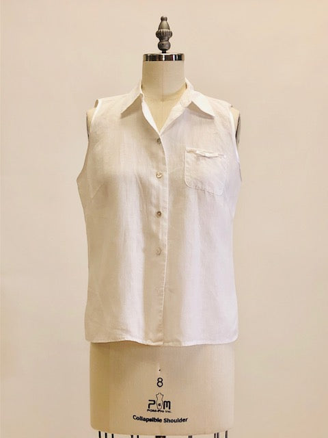 100% white Irish linen, sleeveless top with button down at center front with shell buttons, cute patch pocket with ribbon finishing and bow. Relaxed fit.