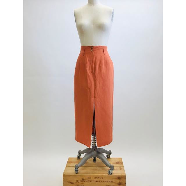 Bright terracotta midi skirt with feminine front slit and front zipper closer. Belt loops and cute back pocket with a nice casual linen/rayon texture. Super cute when worn with flat sandals. 