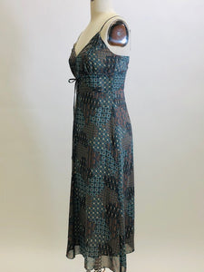 Viscose crepe lightweight A-line midi dress, lined with adjustable spaghetti straps and empire bust style in a teal blue & brown paisley print. Versatile style for casual or even dressier occasions - pairs sweetly with a cardigan, and strappy kitten heels. 