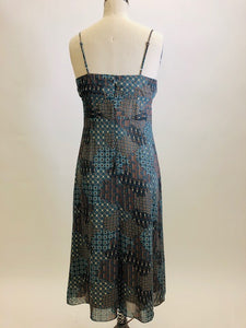 Viscose crepe lightweight A-line midi dress, lined with adjustable spaghetti straps and empire bust style in a teal blue & brown paisley print. Versatile style for casual or even dressier occasions - pairs sweetly with a cardigan, and strappy kitten heels. 