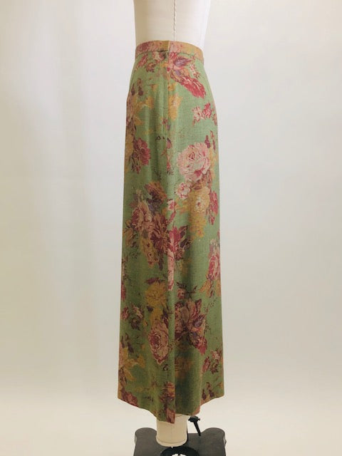 Truly beautiful & feminine midi length green skirt with rose garden print, lined with side zipper. Lightweight wool blend with a slightly A-line silhouette. As a transitional season piece, pairs nicely with your favorite pair of ankle boots. 