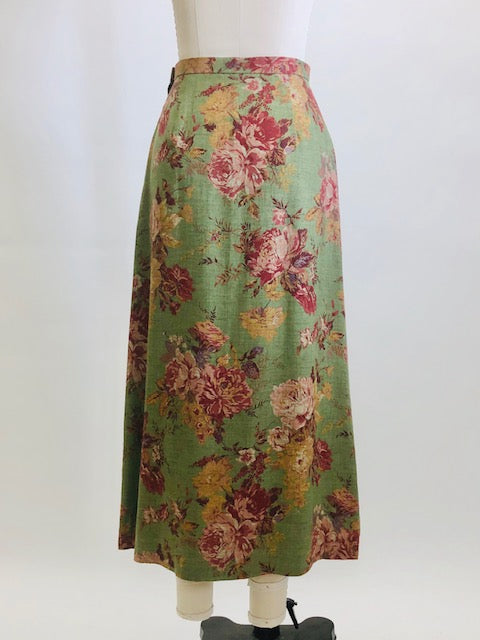 Truly beautiful & feminine midi length green skirt with rose garden print, lined with side zipper. Lightweight wool blend with a slightly A-line silhouette. As a transitional season piece, pairs nicely with your favorite pair of ankle boots. 