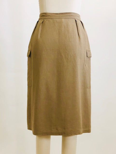 Knee length linen/viscose skirt in a dark khaki and olive tone with interesting snap front wrap overlap at waist, pin tucks at waistband and cargo pockets. Uniquely designed skirt. 