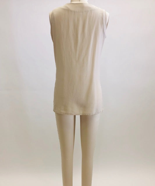 Creamy-taupe sleeveless silk top with button down front. 