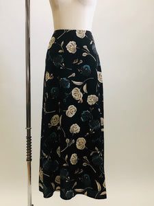 Vintage classic 90s black floral maxi skirt with a soft A-line silhouette, accented with teal and cream floral print. Unlined with center back zipper closure. 