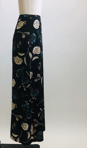 Vintage classic 90s black floral maxi skirt with a soft A-line silhouette, accented with teal and cream floral print. Unlined with center back zipper closure. 