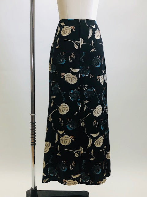 Vintage classic 90s black floral maxi skirt with a soft A-line silhouette, accented with teal and cream floral print. Unlined with center back zipper closure. 