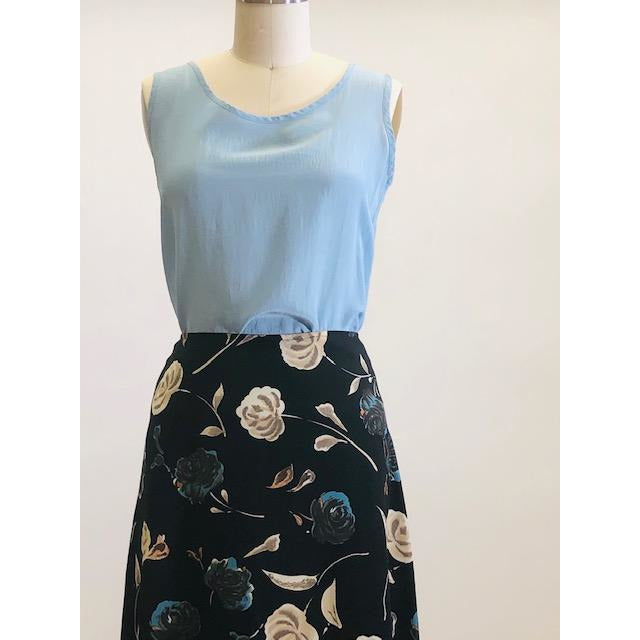 Powder blue silk sleeveless tank top. Pairs nicely for the summer with trousers, culottes and skirts.