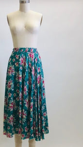 Gorgeous green-tale midi length skirt with feminine roses and elasticated waist. The label states cotton, but it's very drapey, and almost reminds me of a soft lightweight rayon in touch and drape. Has a very light lining. Perfect for twirling. 