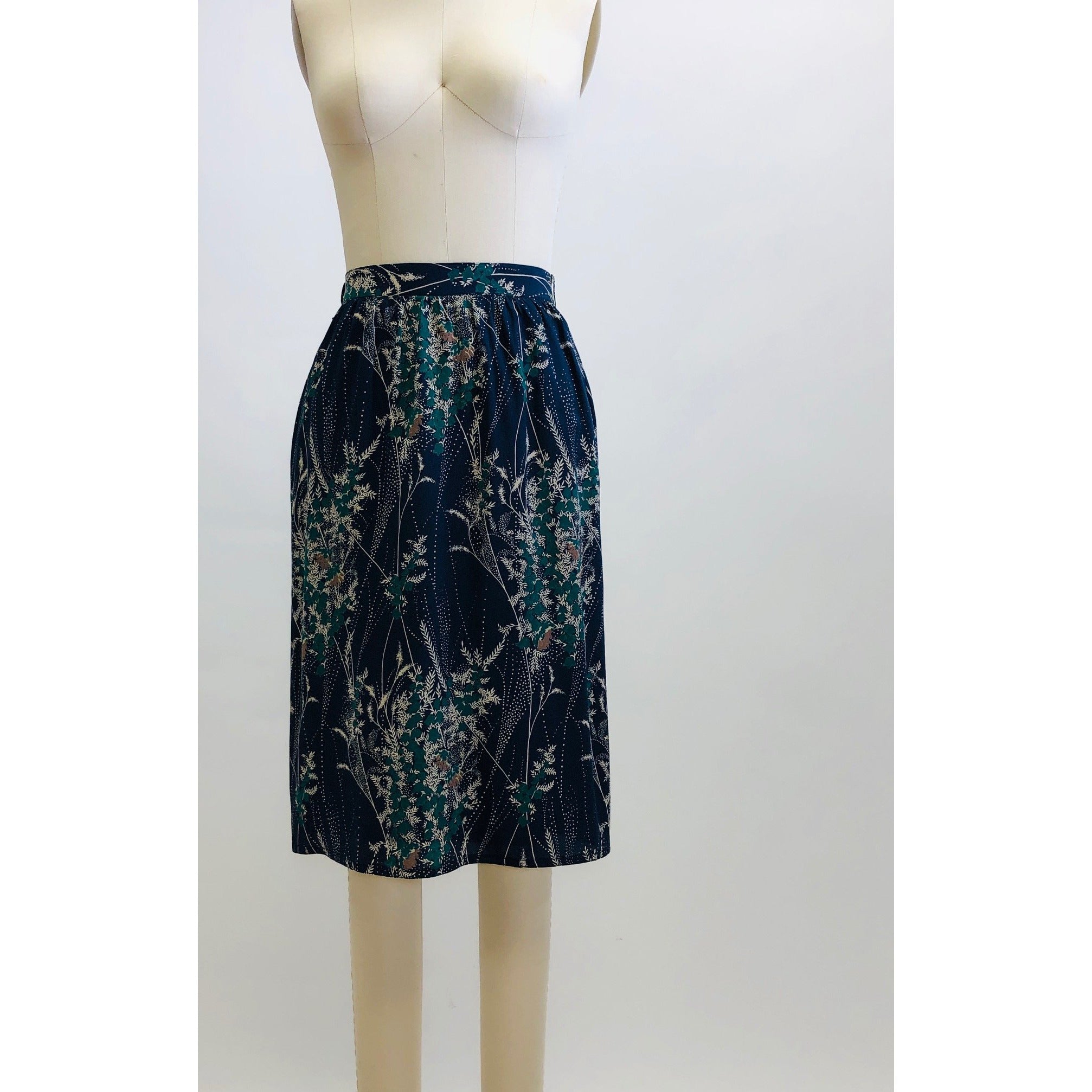 Elegant and timeless vintage knee length, lined skirt with subtle gathering at waistband and back zipper closure. 