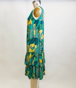 Beautiful vintage Alfred Sung rayon sleeveless dress with 20s inspired low waist ruffle hem and straight silhouette. This dress has a gorgeous tropical print of green and yellow florals. Label Sung Sport by Alfred Sung.