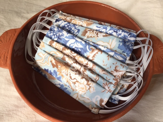 This is a double-layer face mask made of unused deadstock / remnant fabric in a beautiful vintage romantic floral print. A pleated style that is washable and reusable. Fit is for Adult, with ¼” flat braided elastic to securely hold behind ears. Made in Canada. 