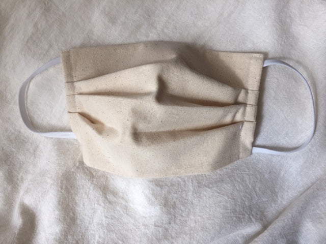 This is a triple-layer eco-friendly face mask made of 100% unbleached organic muslin cotton with elastic loops. Great alternative for those of us with skin sensitivities to bleaches and dyes. A pleated style that is washable and reusable. Made in Canada. 