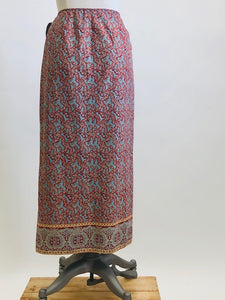 Vintage Ralph Lauren wrap midi cotton skirt with side waist tie in a vibrant paisley print of blues, reds and light orange, accented by a striking border. 