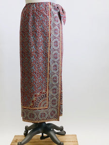 Vintage Ralph Lauren wrap midi cotton skirt with side waist tie in a vibrant paisley print of blues, reds and light orange, accented by a striking border. 