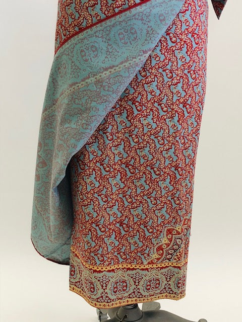 Vintage Ralph Lauren wrap midi cotton skirt with side waist tie in a vibrant paisley print of blues, reds and light orange, accented by a striking border. 